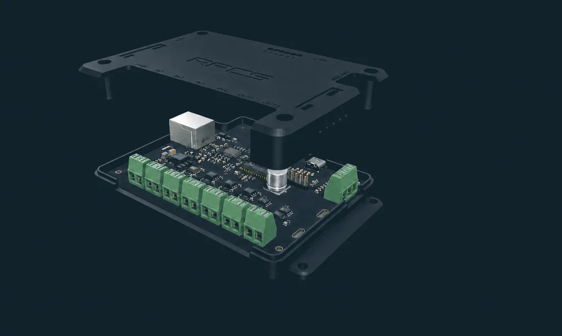 An RPCS field device shown separated into its three parts: the flange-mounted lid above, the circuit board with its row of pluggable terminal blocks in the middle, and the base tray below.